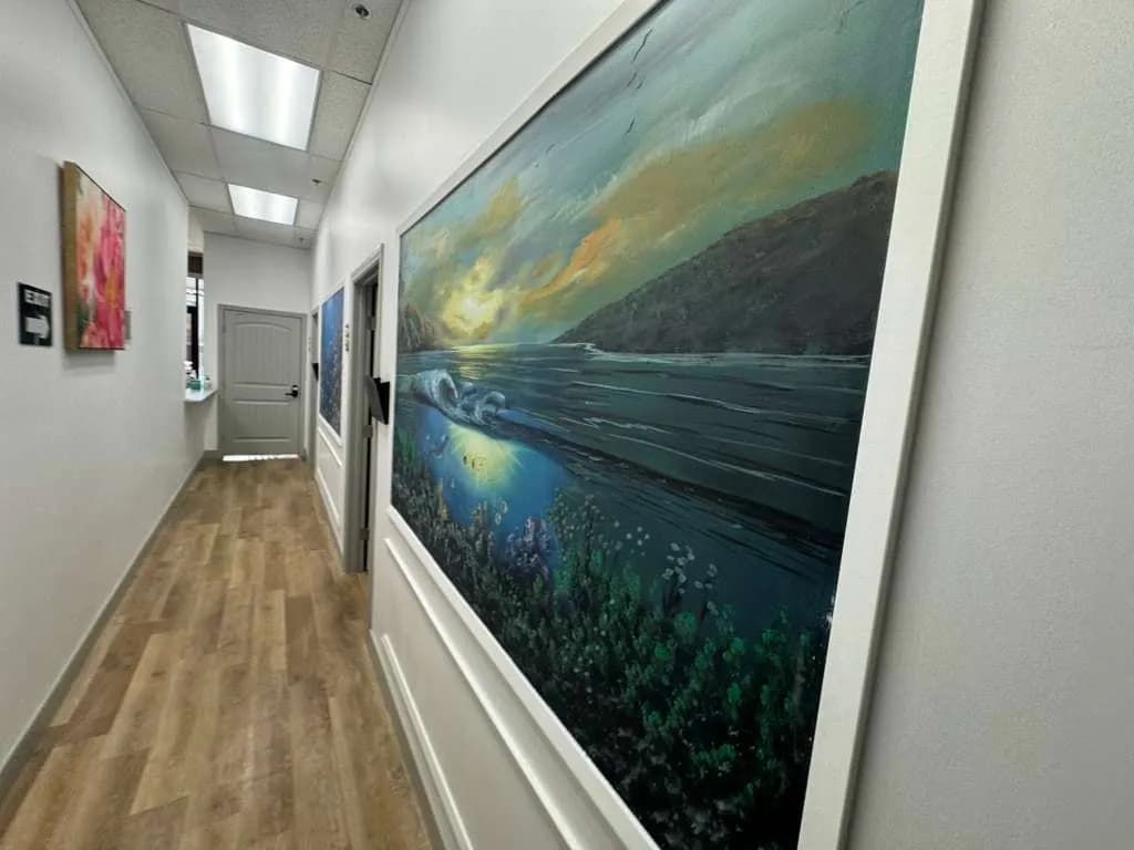 Calm art-decorated therapy hallway at Palm Urgent Care mental health clinic San Diego