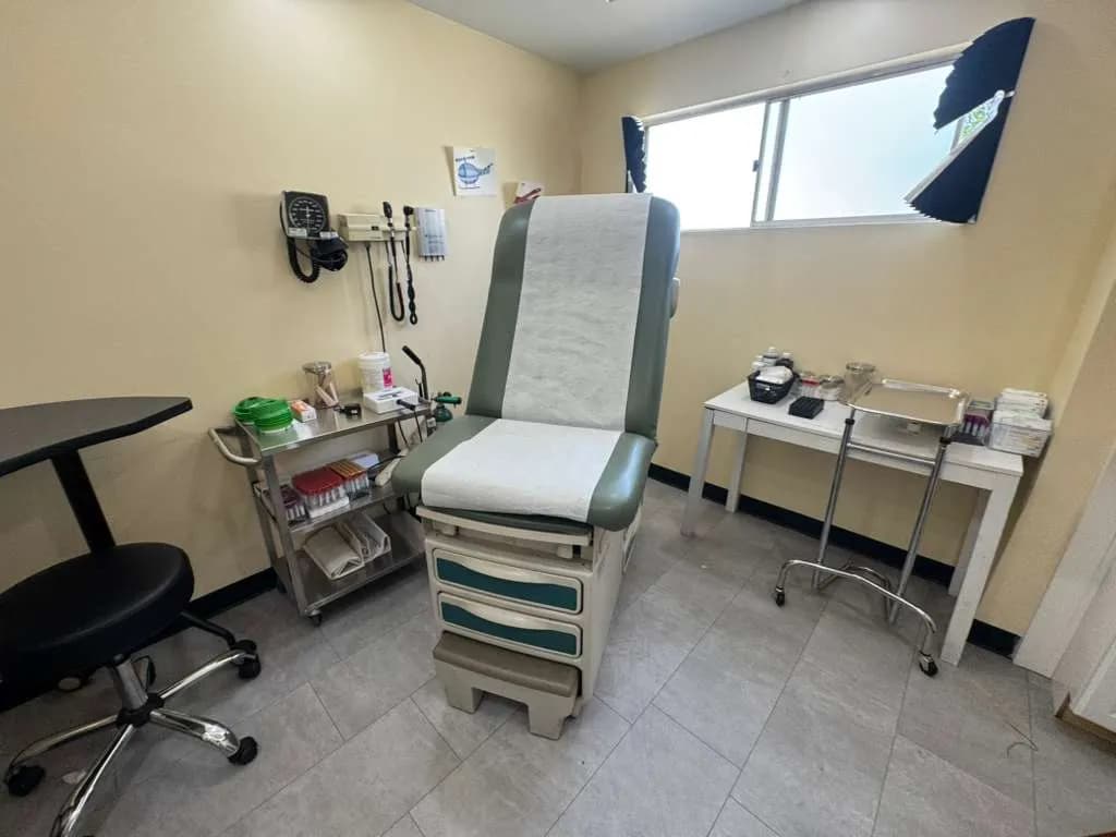 Board-certified urgent care exam room with diagnostic equipment in San Diego California